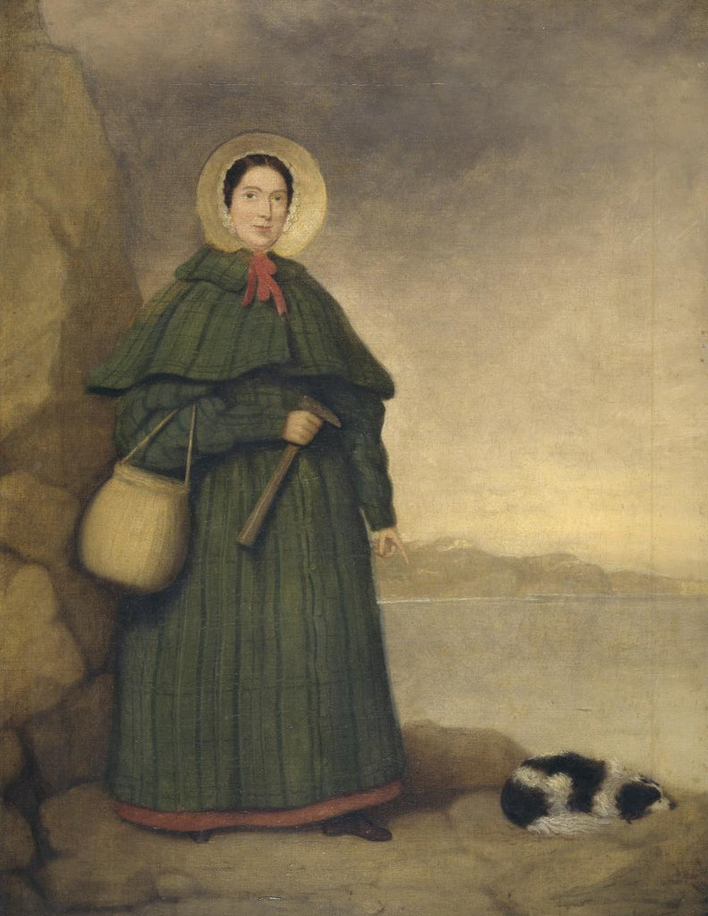 A portrait of Paleontologist Mary Anning, pictured with a rock hammer and dog. They stand on a high cliff at the coastline.