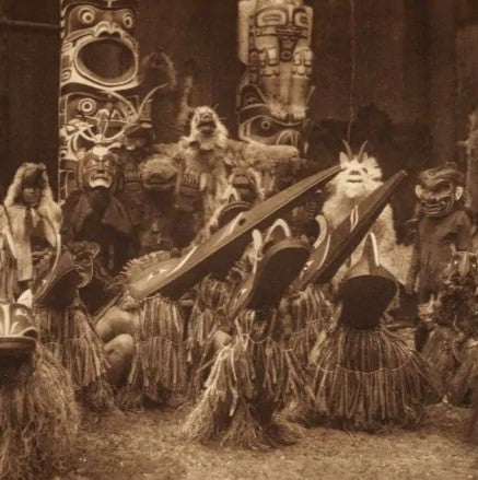 A Native American Potlatch ceremony in which gifts are exchanged.