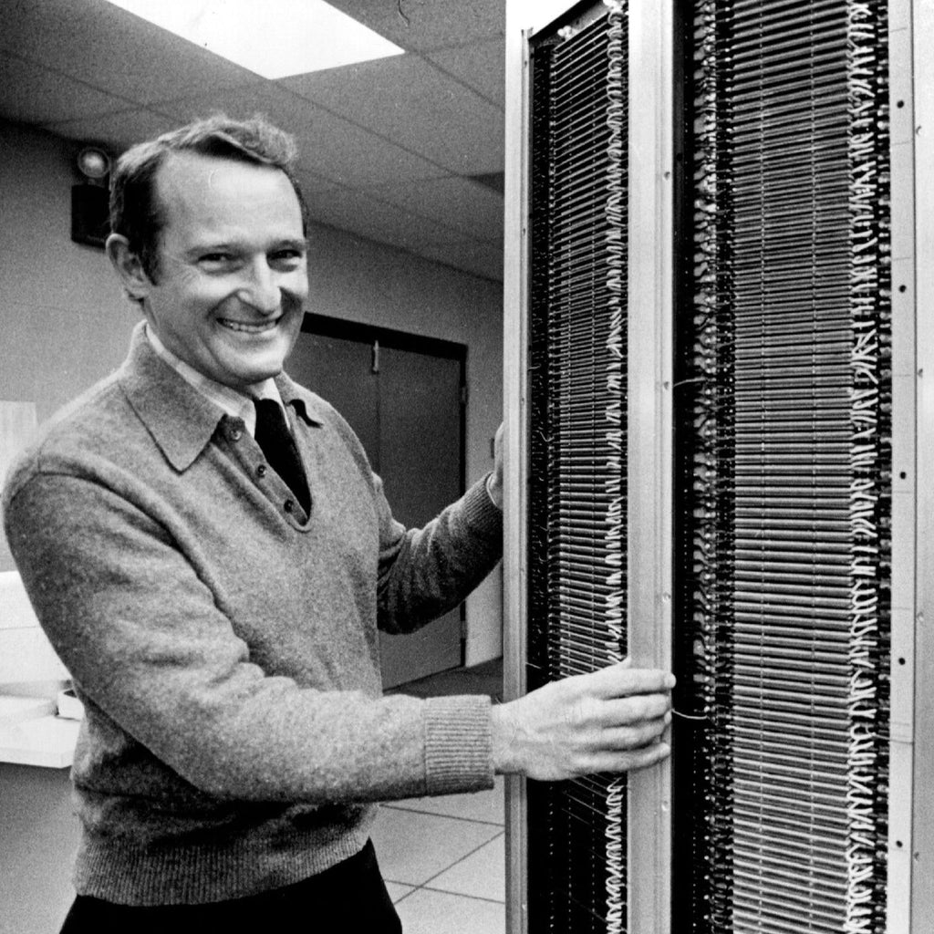 Seymour Cray posing with his supercomputer the Cray-1